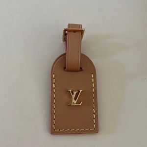 Authentic Louis Vuitton natural leather name tag .